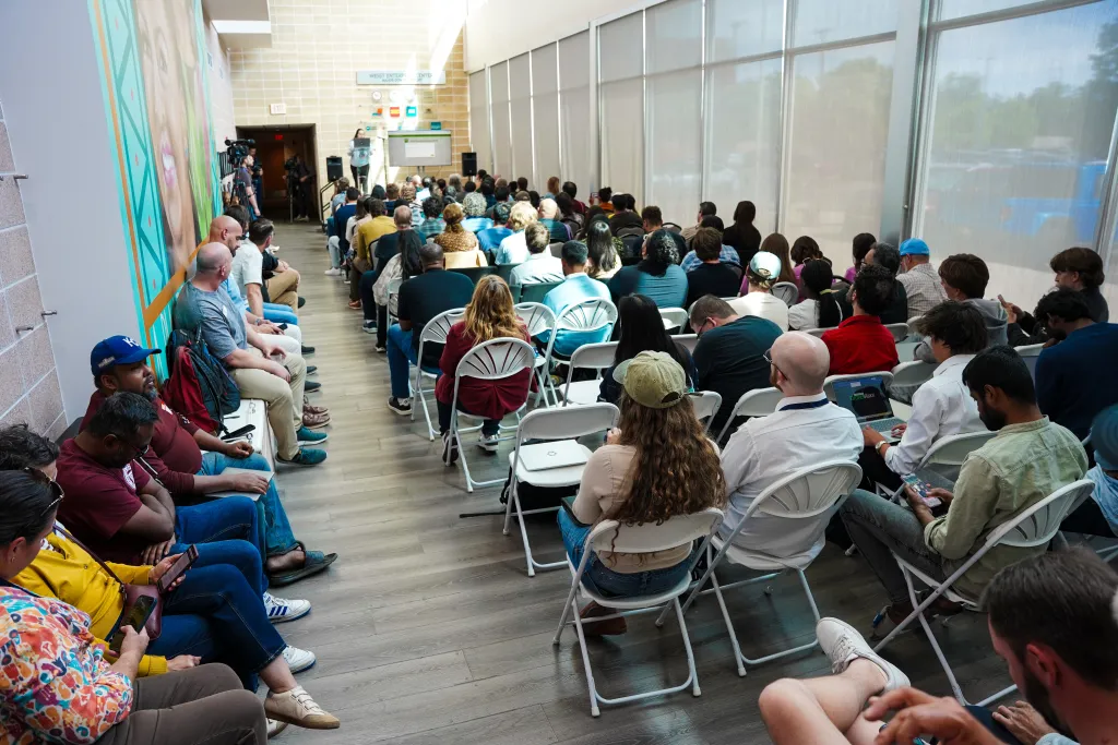 Aerial view of the seated crowd near the mural at Desert Dev Lab 2026