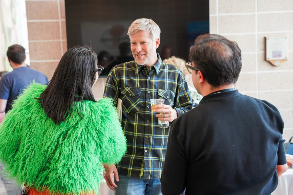 Attendees chatting near the TechTalks booth at Desert Dev Lab 2026